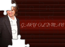 Gary Oldman,biała koszula, marynarka